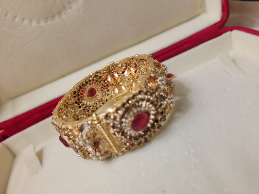 Imported Antique Indian Gold-Plated Bracelet with Red Teardrop Stones and Pearls for Bridal Elegance