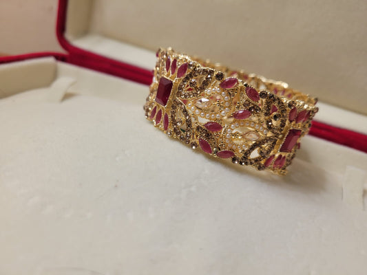 Imported Luxurious Ruby Stones and Gold-Plated Bridal Bracelet with Intricate Handcrafted Detailing