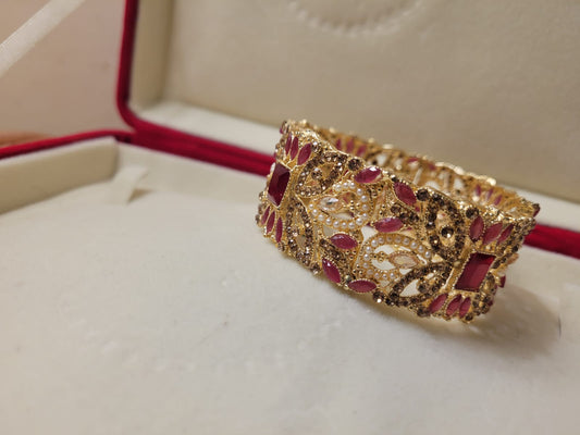 Imported Luxurious Ruby Stones and Gold-Plated Bridal Bracelet with Intricate Handcrafted Detailing